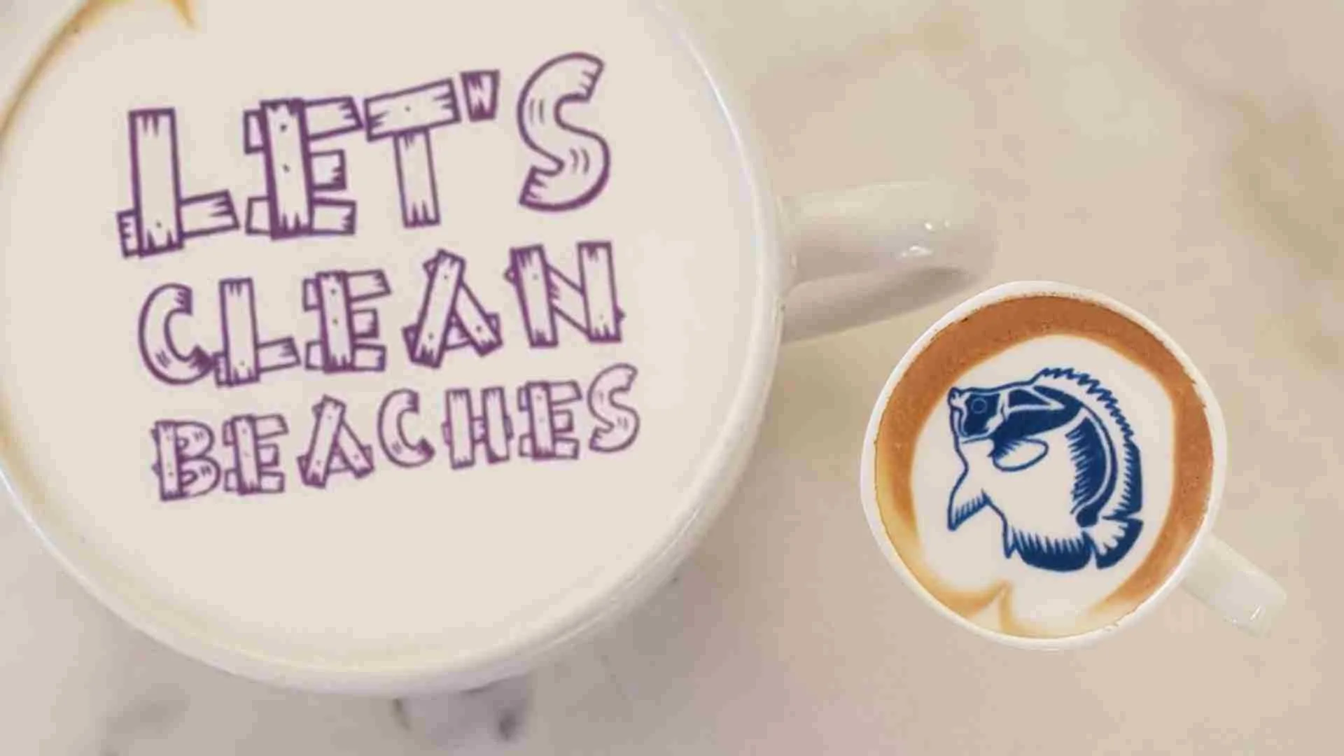 coffee cup saying 'let's clean beaches' in ripples print