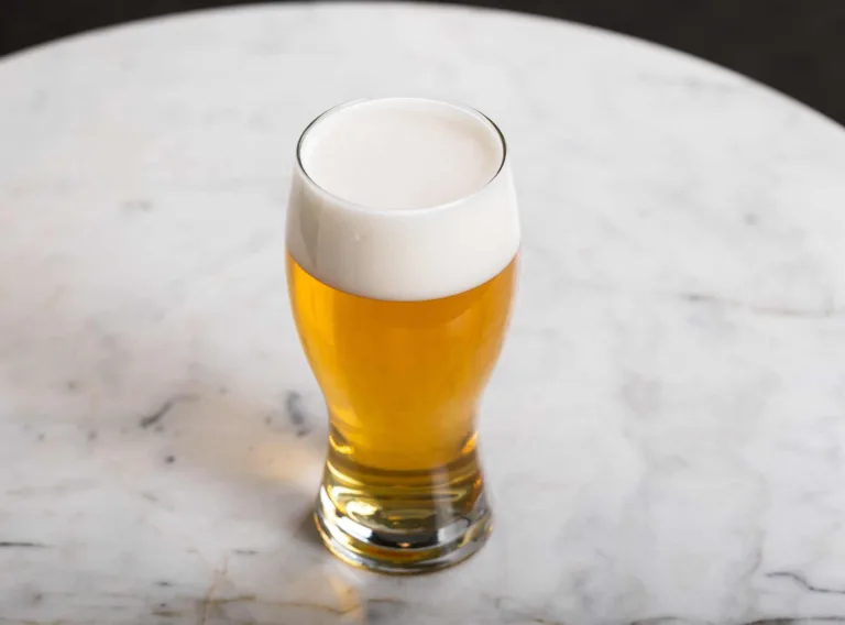 Beer with a good head on a table
