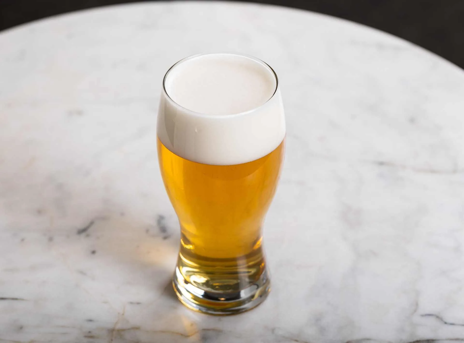 Beer with a good head on a table